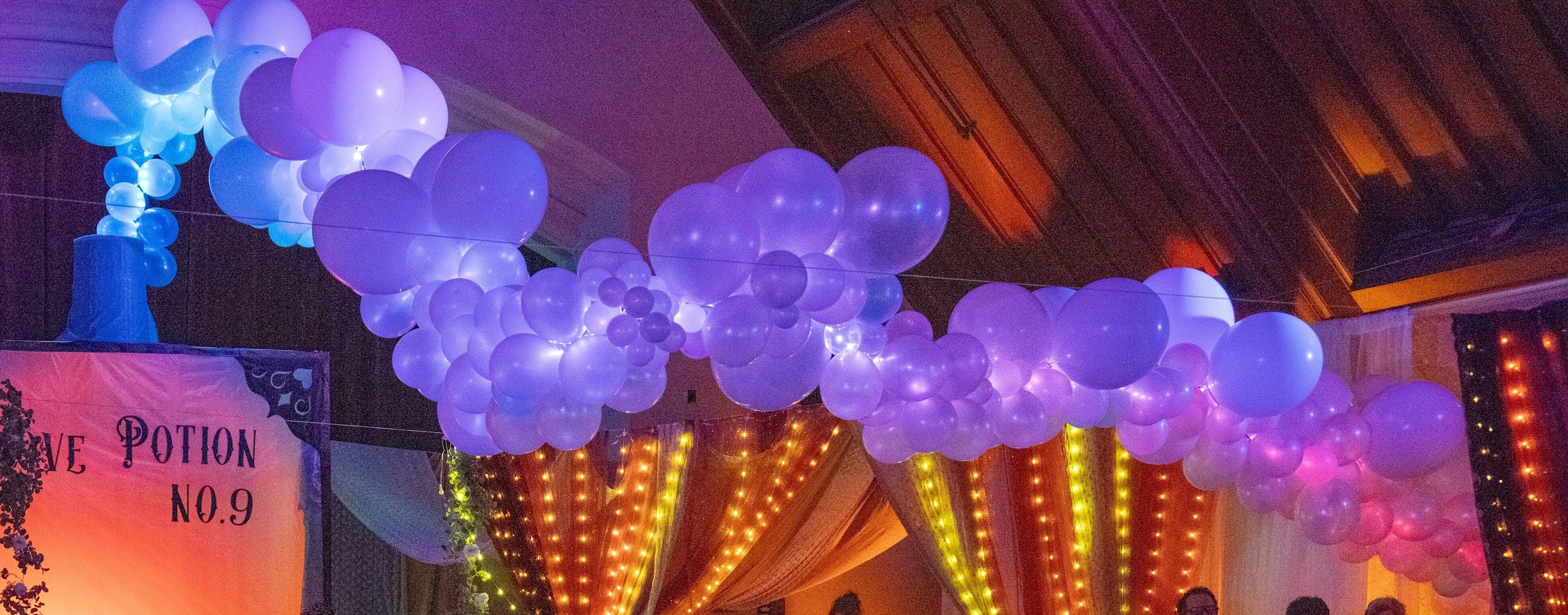 Detail of balloon clouds with LED chase lighting creating a flowing water effect