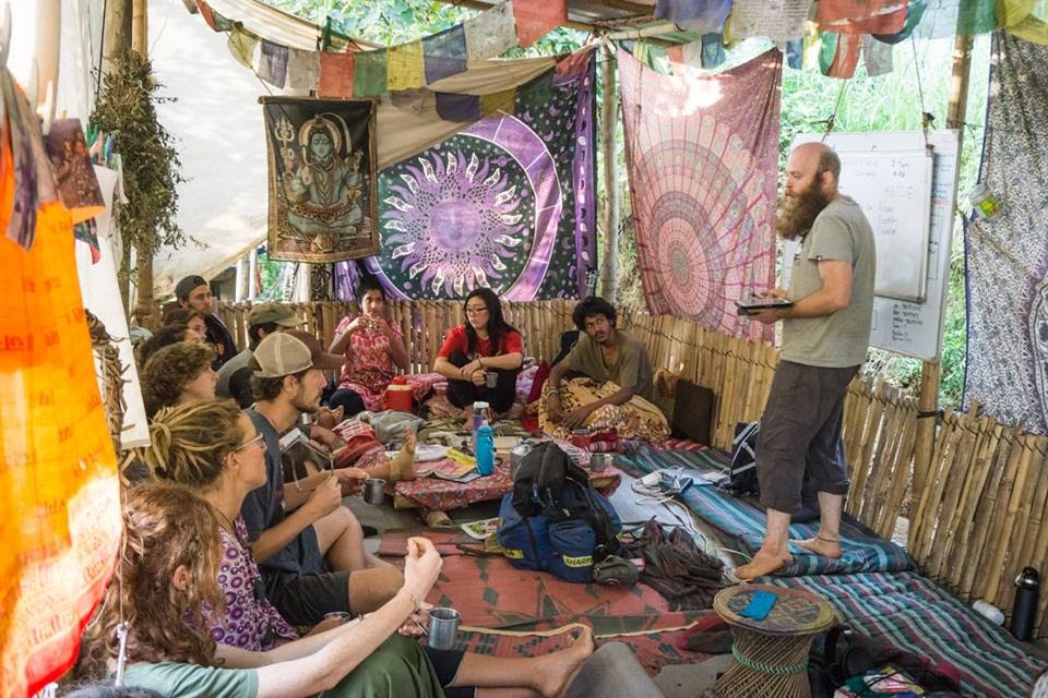 Group gathered in the outdoor meeting space during a teaching session